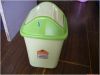 Green garbage bin with push lid