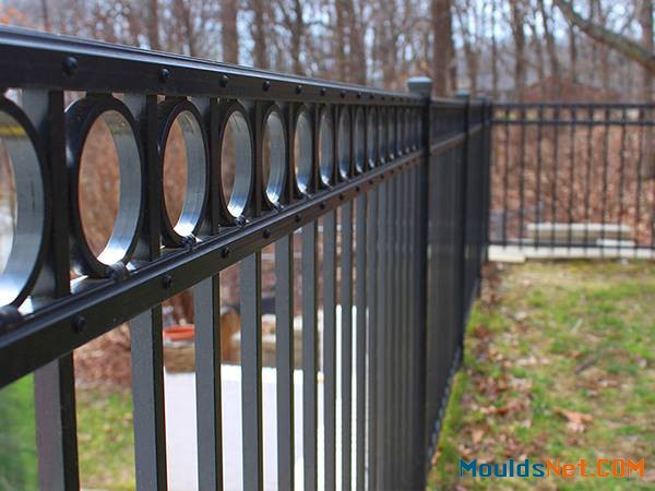 Black flat top ornamental steel tubular fence with decorative rings.
